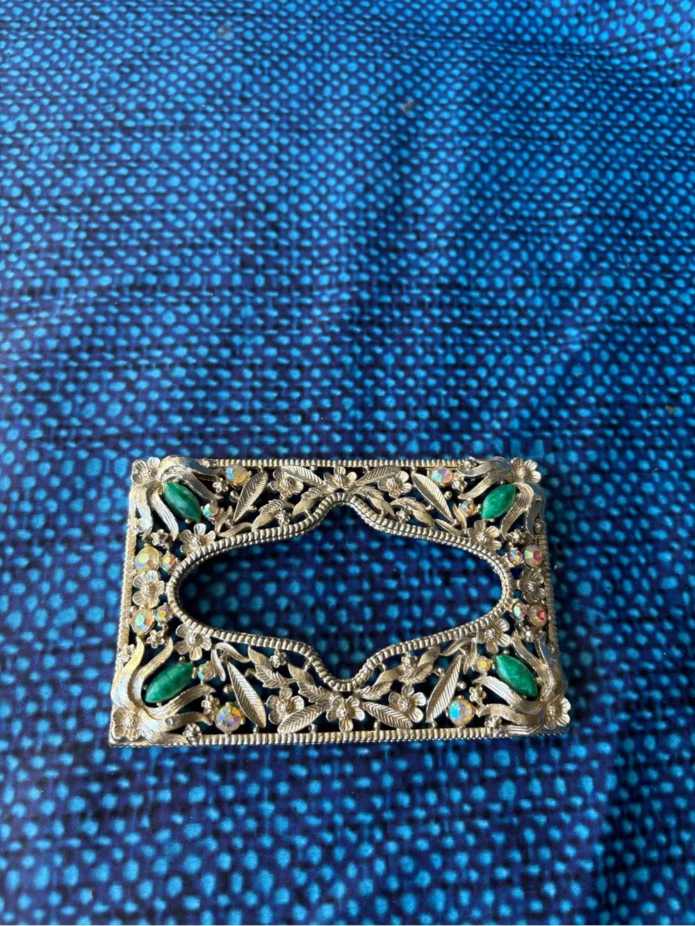 Ornate Silver-Tone Rectangular Brooch with Green Gem Accents